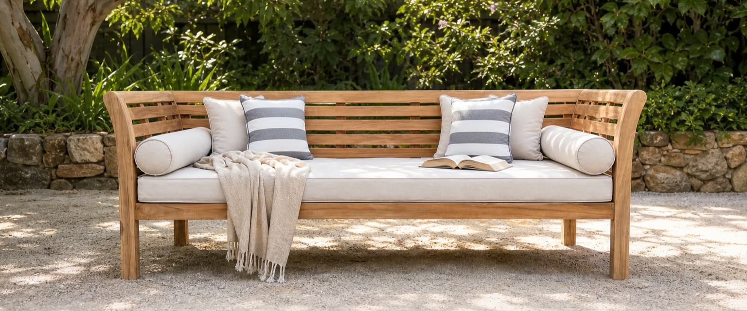 Ipanema teak daybed in a shaded garden nook