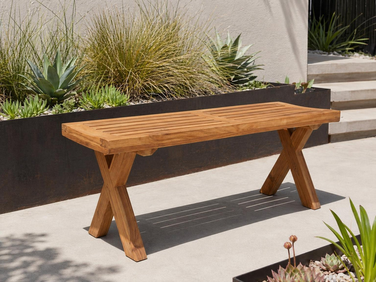 teak cross leg dining bench in outdoor setting