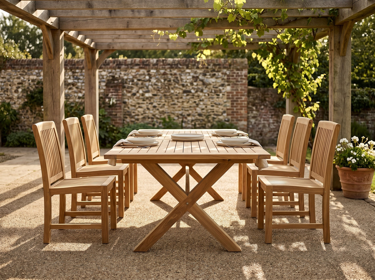 teak cross leg rectangular outdoor dining table in outdoor setting