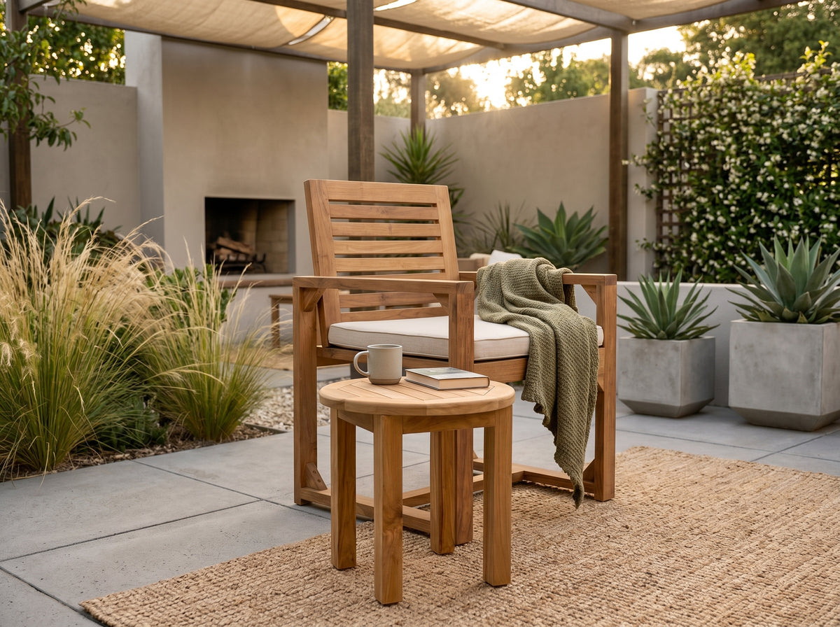 teak round outdoor coffee table in outdoor setting