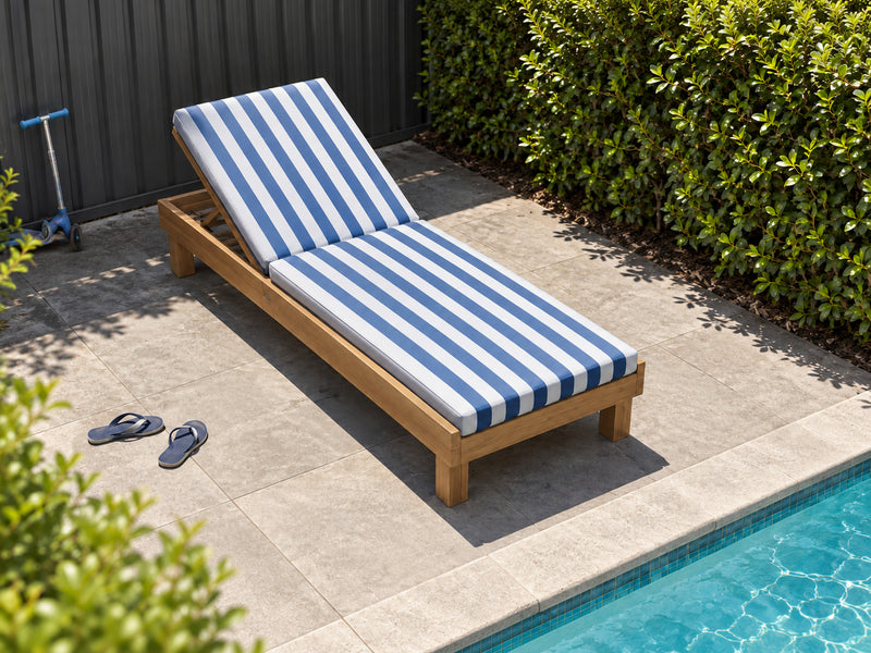 Portsea Wide teak pool lounge with a blue and white stripe cushion in a suburban backyard