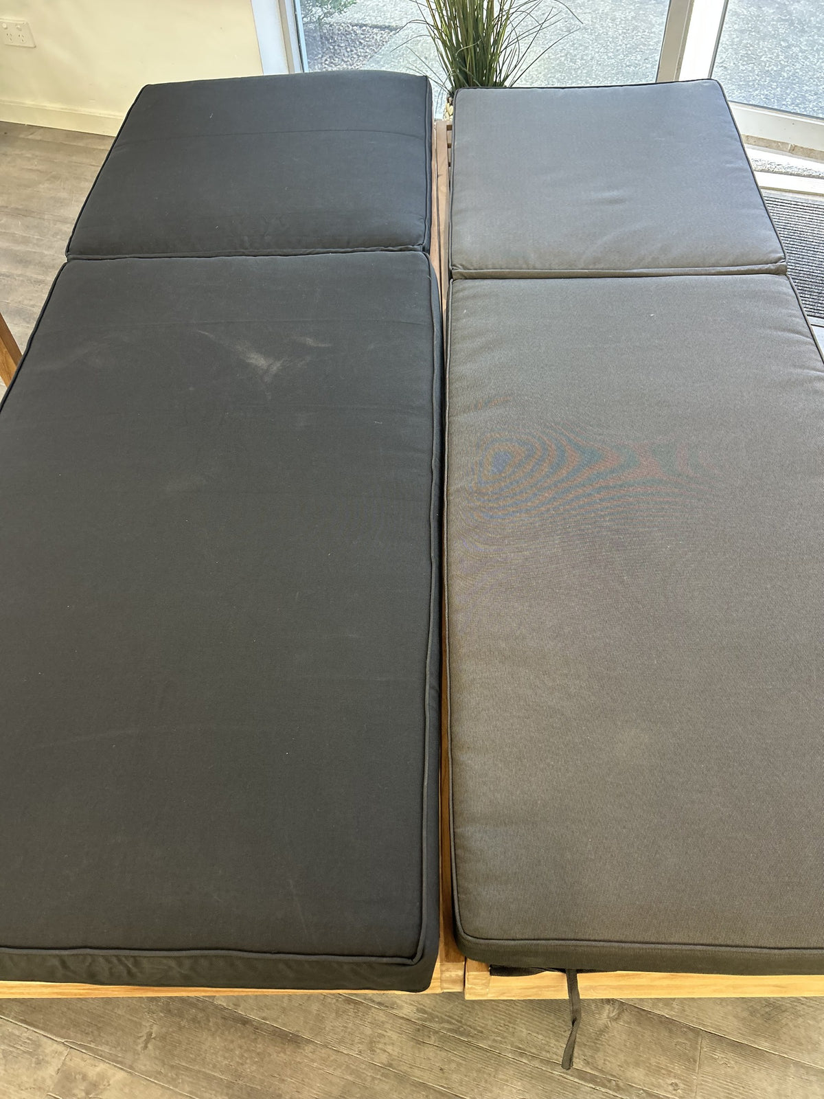 Sunproof pool lounge cushions side by side: Black on the left, Coal on the right