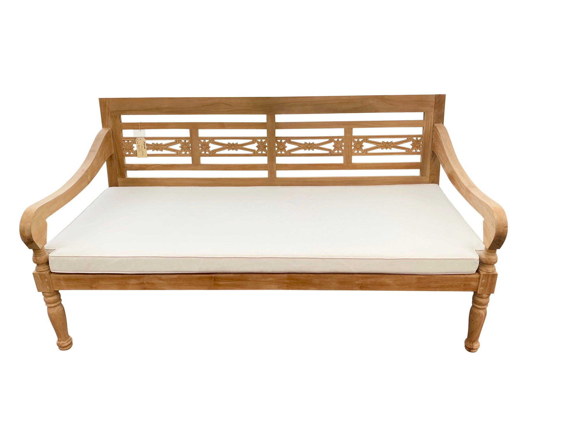 Floral teak daybed with hand-carved Balinese back panels, turned legs and a cream cushion