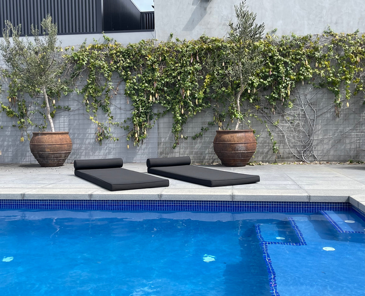 Santorini outdoor sun bed mattresses on Sunproof fabric beside a swimming pool