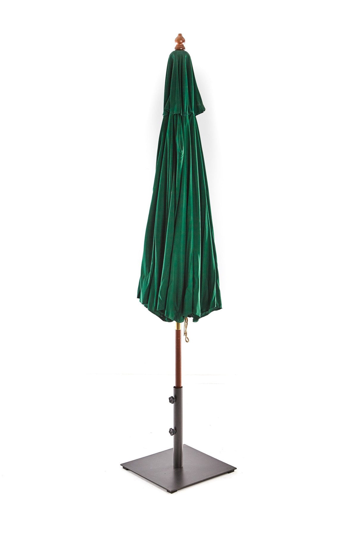 Green market umbrella closed and tied for storage
